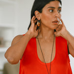 Monikh Dale x Daphine Vol. II. Monikh wears the Rochelle hoop Earrings and Singh Necklace.