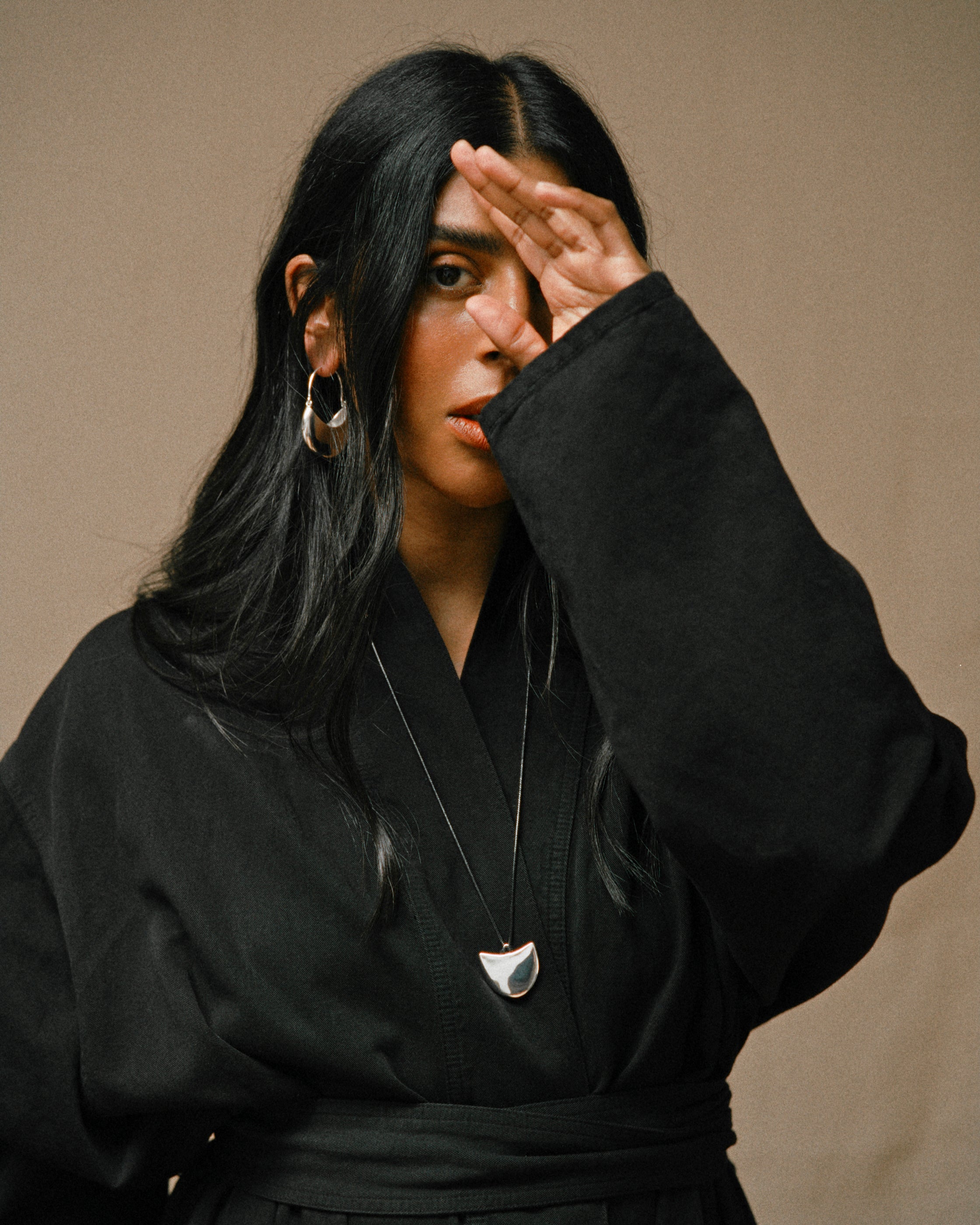 Monikh Dale x Daphine Vol. II. Monikh wears the Rochelle Sterling Silver Plated Hoop Earrings and Singh Sterling Silver Plated Pendant Necklace.