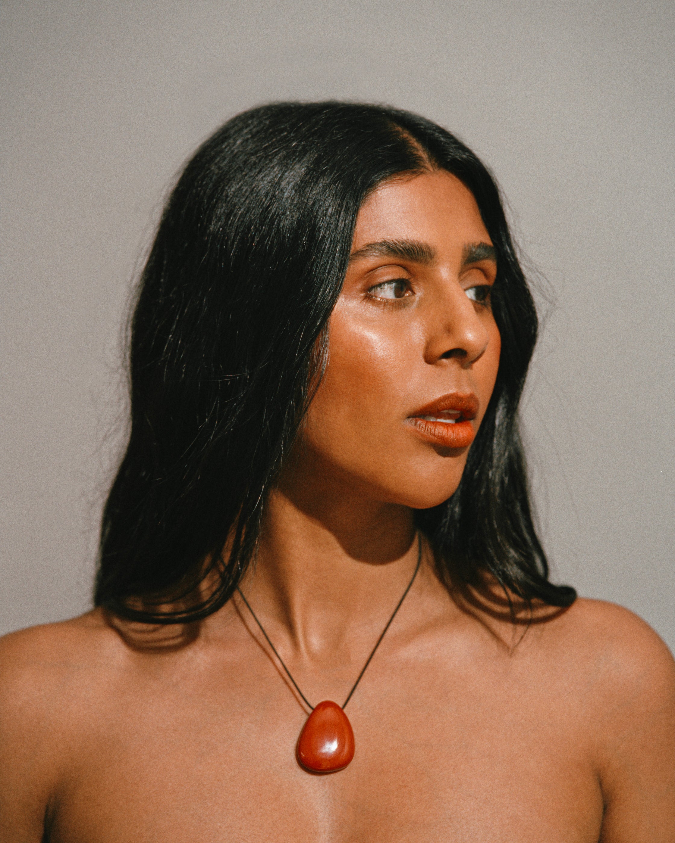 Monikh Dale x Daphine Vol. II. Monikh wears the Swin red Jasper Stone Necklace.